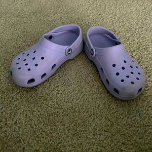 Purple crocs that have been used